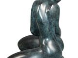 statue of a woman sitting on her knees on a white background