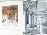 an open book with a picture of a dining room in it