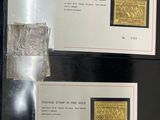 three different types of stamps are on display in a glass case