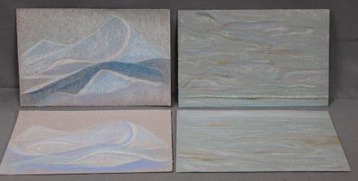 four paintings of different colors are displayed on a gray surface