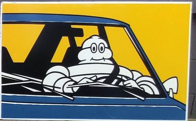 tableau représentant un homme au volant d'une voiture, le sourire aux lèvres