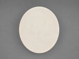 a close up of a white plate on a gray surface