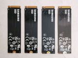 four different types of hard drives are lined up on a white surface