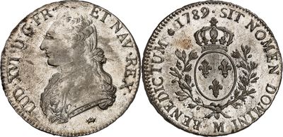 une vieille pièce d'argent ornée d'une couronne