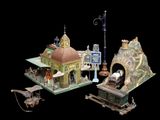 a small model of a train station on a black background