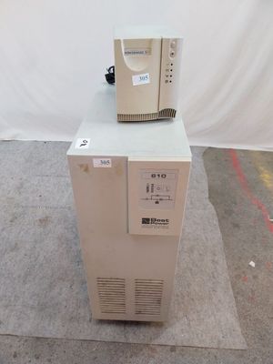 a white refrigerator with a computer on top of it