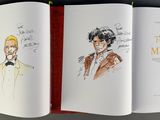 an open book with a drawing of a man and a woman on it