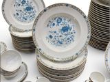 a lot of plates and cups on the table