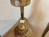 a glass lamp that is sitting on a table