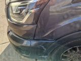 a close up of a car parked on the side of the road