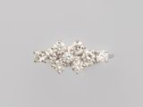 a close up of a diamond ring on a white background