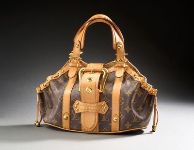 a louis vuitton handbag with a gold buckle