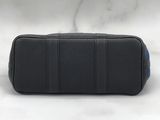 a black and blue leather case sitting on top of a marble counter