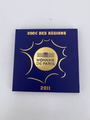 a close up of a medal on a white surface