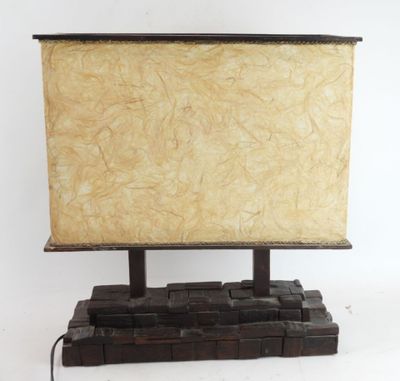a small television on a wooden stand on a white surface