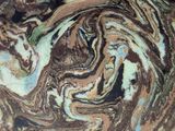 a close up of a bowl with a swirl on it
