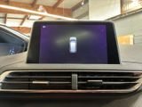 a picture of a car dashboard with a cell phone in the center