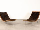 pair of lounge chairs in the style of the sixties