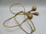 rope wrapped around a wooden object on a white surface