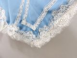 a close up of a blue and white dress with lace on it