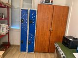 two blue lockers in the corner of a room