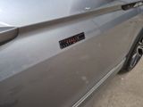 a close up of a car door with a sticker on it