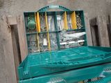 an image of a green tool box with tools in it
