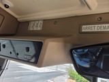 a close up of a car ' s dashboard with a sign on it