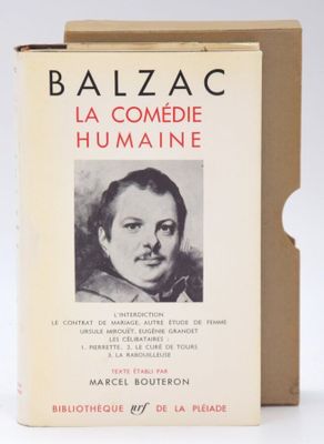 an old book with a picture of a woman in a black and white photo