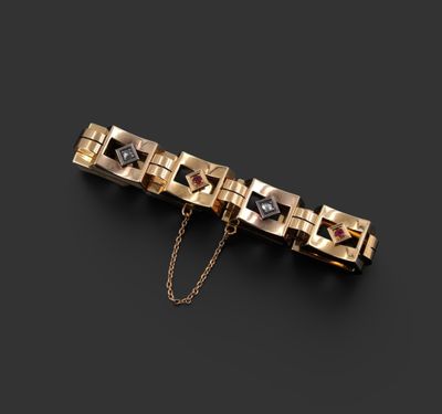 un bracelet en or serti de diamants noirs et blancs