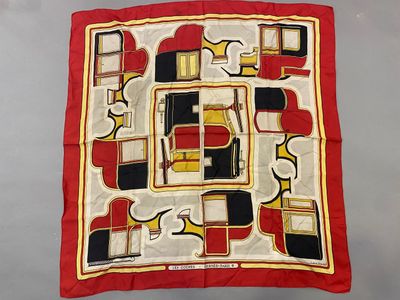 an image of a red and black and yellow square scarf