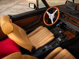 a car that has a steering wheel and some leather seats
