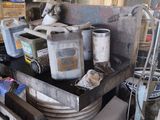 a pile of junk that is sitting in a garage