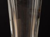 a glass of water sitting on a wooden table