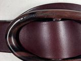 a belt with a metal buckle on a mannequin dummy