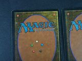 two decks of magic the gathering are shown on a table