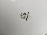 an image of a close up of a bowl with a lid on a table