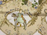 an image of a horse and rider on a floraled table cloth