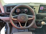 the interior of a car with a steering wheel and dashboard controls