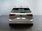 the back of a silver volkswagen vw golf parked in a white room