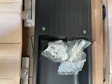 a black box with a bunch of bags in it