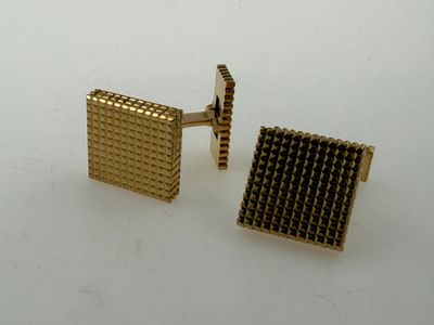 gold plated square cufflinks with black squares on them