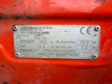 a metal plate on the back of a red vehicle