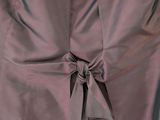 a dress that has a tie on the back of it
