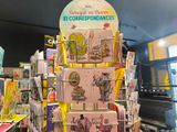 a large stack of books on display in a store