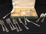 a box of silverware on a table with forks and spoons in it