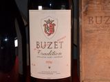 a bottle of wine sitting next to a box of wine