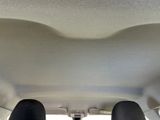 someone is sitting in the back seat of a car with their feet up