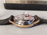 a close up of a watch on a table