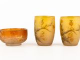 three different vases sitting next to each other on a white surface